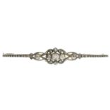 An early 20th century silver and gold rose-cut diamond bar brooch.With Dutch marks.Length 6.5cms.