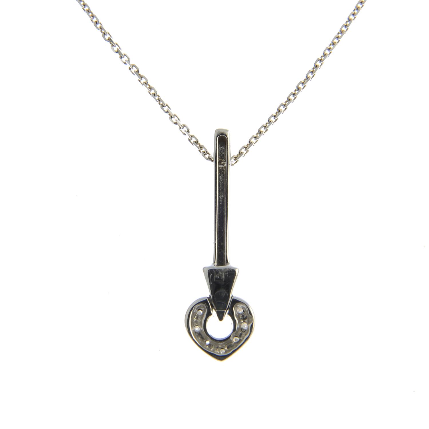 An 18ct gold diamond heart and arrow pendant, suspended from a chain. - Image 2 of 3