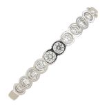 An 18ct gold diamond half eternity ring.Estimated total diamond weight 0.20ct.Hallmarks for London,