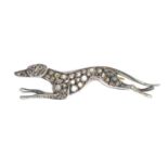 A diamond and ruby greyhound brooch.Length 4.8cms.