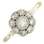 A mid 20th century 18ct gold and platinum diamond cluster ring.Estimated total diamond weight