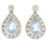 A pair of aquamarine and diamond cluster earrings.