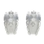 A pair of 18ct gold diamond earrings.Estimated total diamond weight 0.60ct,