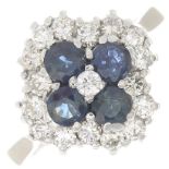 A diamond and sapphire cluster ring.Estimated total diamond weight 0.50ct.