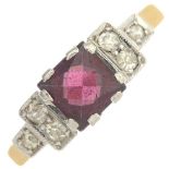 A mid 20th century 18ct gold and platinum garnet and diamond dress ring.Estimated total diamond