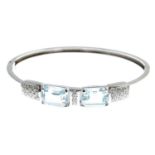 An aquamarine and diamond bangle,