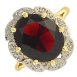 A garnet and diamond cluster ring.Garnet calculated weight 4.61cts,