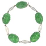 A jade bracelet.Stamped 14ct.Length 21cms.