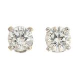 A pair of brilliant-cut diamond stud earrings.Estimated total diamond weight 0.35ct,