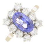 A sapphire and diamond cluster ring.