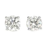 A pair of brilliant-cut diamond earrings.Estimated total diamond weight 0.40ct,