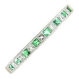 An emerald and diamond half eternity ring.Estimated total diamond weight 0.15ct.Ring size N.