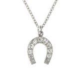 A diamond horseshoe pendant,