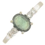 A green tourmaline and diamond ring.Tourmaline calculated weight 0.50ct,