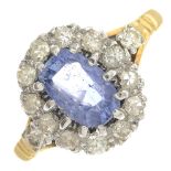 A 1960s 18ct gold sapphire and diamond cluster ring.Sapphire calculated weight 1.39cts,