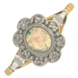An opal and diamond cluster ring.Stamped 18ct and Plat.Ring size N.