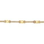 A yellow sapphire and diamond bracelet.Estimated total diamond weight 1.30cts.French assay