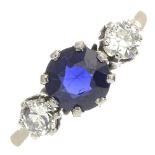 A synthetic sapphire and diamond three-stone ring.Estimated total diamond weight 0.40ct,