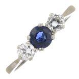 A sapphire and diamond three-stone ring.Estimated total diamond weight 0.40ct,