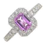 A pink sapphire and diamond dress ring.Pink sapphire calculated weight 0.79ct,
