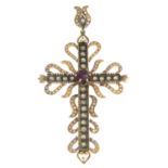 A diamond and ruby cross pendant.Estimated total diamond weight 1.10cts.Length 8.8cms.