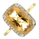 An 18ct gold citrine and diamond cluster ring.One diamond deficient.Citrine calculated weight