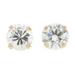 A pair of brilliant-cut diamond stud earrings.Estimated total diamond weight 0.60ct,