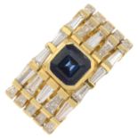 A sapphire and diamond dress band ring.Sapphire calculated weight 1.05cts,