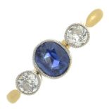 A sapphire and diamond three-stone ring.Estimated total diamond weight 0.20ct,