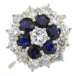 An 18ct gold diamond and sapphire cluster ring.Estimated total diamond weight 1ct,