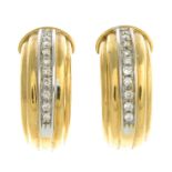 A pair of diamond earrings.Estimated total diamond weight 0.40ct.Stamped 18kt.Length 2.3cms.