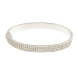An 18ct gold diamond hinged bangle Estimated total diamond weight 2.70cts.Hallmarks for
