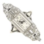 A mid 20th century diamond watch ring.Estimated total diamond weight 0.50ct.Ring size N.