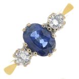 An 18ct gold sapphire and diamond three-stone ring.Estimated total diamond weight 0.20ct,