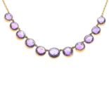 An early 20th century 9ct gold amethyst necklace.Stamped 9ct, partially indistinct.Length 48.3cms.