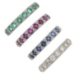 Four gem-set full eternity rings.Gems to include diamond,