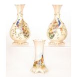 Three pieces of Locke & Co Worcester comprising a pair of vases with pierced panels to the sides