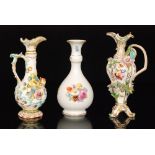 An early 20th Century Meissen bottle vase decorated with sprays of hand painted flowers against a