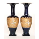 A large pair of Royal Doulton Chine Ware vases of footed shouldered ovoid form with flared collar