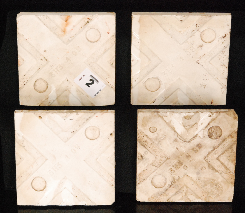 A set of four early 20th Century 4 inch dust pressed tiles decorated with a design in the manner of - Image 2 of 2