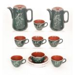 A 1950s tea and coffee service by Tern, green with incised image of a rearing unicorn,