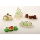 Five assorted novelty Carlton Ware cruet sets of varying form to include a Crinoline lady set and