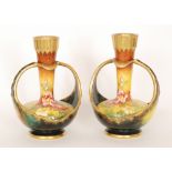 A pair of late 19th Century Royal Bonn vases of globe and shaft form each decorated with hand