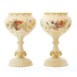 A pair of late 19th Century Royal Worcester pedestal pot pourri bowls decorated by Edwin Raby with