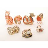 Seven assorted Royal Crown Derby paperweights comprising two cats (one marked as a second),