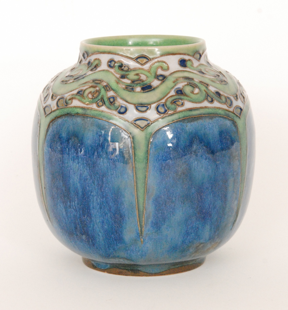 An early 20th Century Royal Doulton Lambeth Stoneware vase of ovoid from with a scrolling foliate