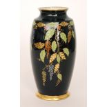 A 1930s Carlton Ware Art Deco vase of footed barrel form decorated in the Leaf pattern with gilt