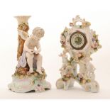 A late 19th Century Continental candlestick formed as a cupid fixing his bow with a quiver of