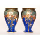 A pair of 1930s Crown Devon Art Deco vases each of swollen footed form decorated in pattern 2073