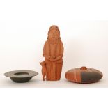 A large terracotta clay studio pottery figural group by Joan Elizabeth Woollard depicting a lady